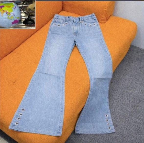Light Blue High-Flare Denim Jeans with Metallic Silver Grommet Detailing
