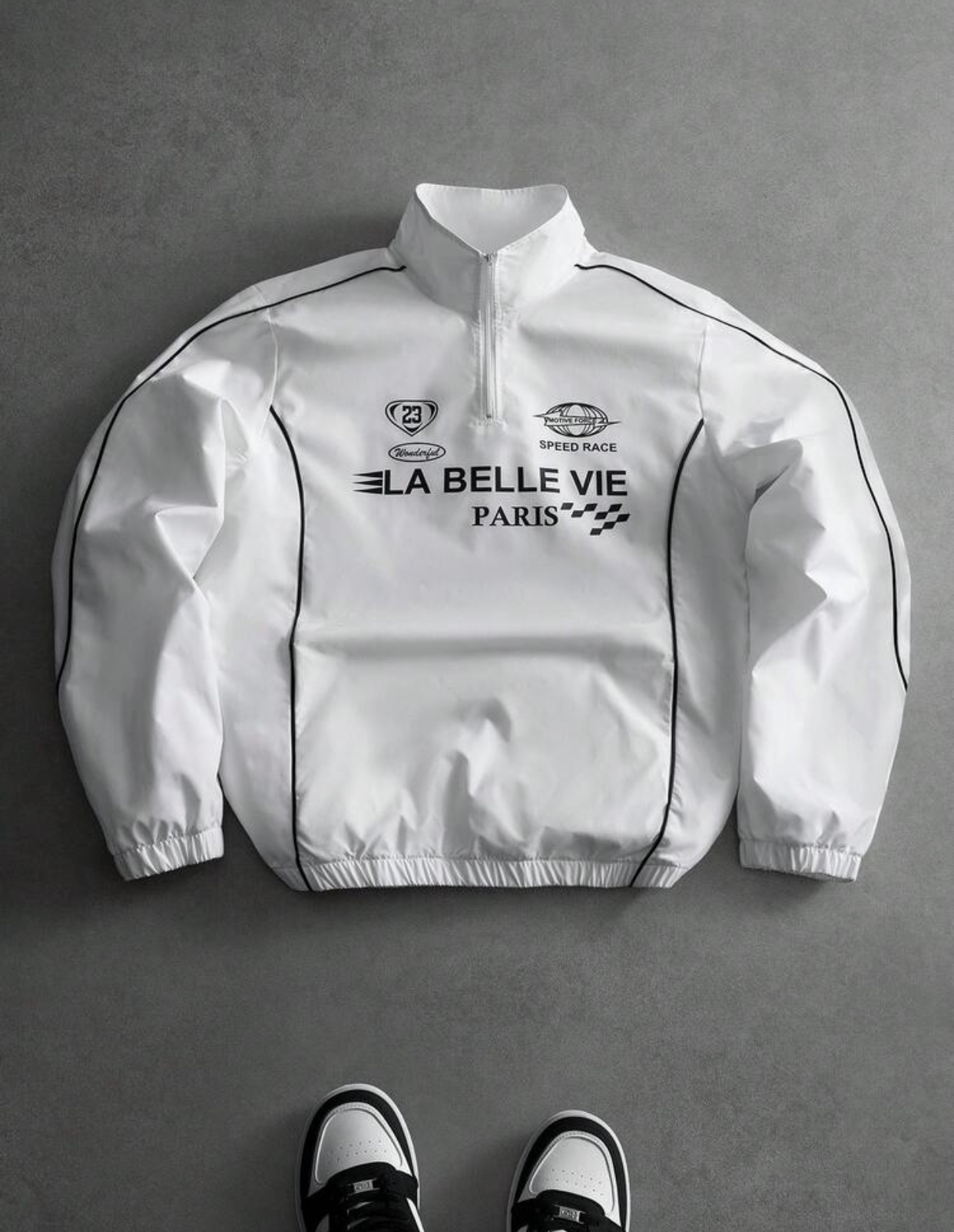 Sporty Racing-Inspired Pure White Half-Zip Windbreaker Pullover Jacket Featuring Thin Black Contrast Boundary Piping and High-Speed "LA BELLE VIE PARIS" Track and Field Graphic Typography