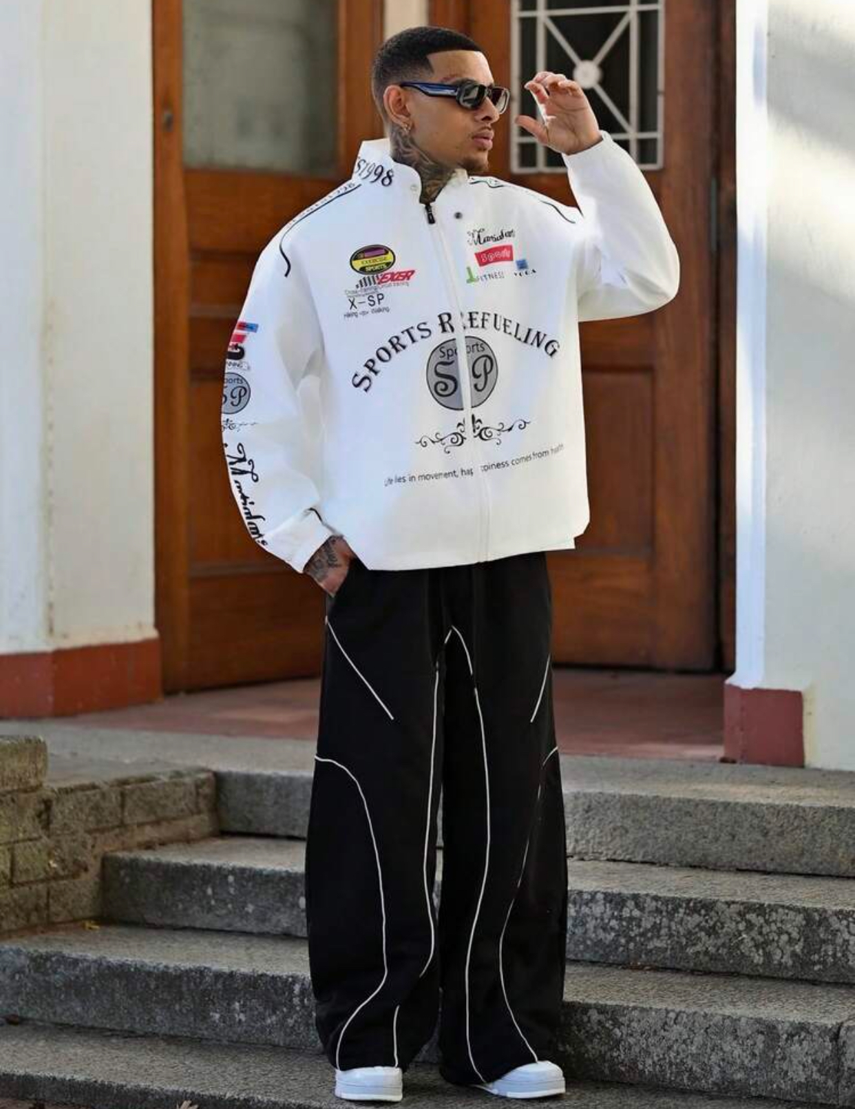 Retro Motorsport-Inspired White Windbreaker Racing Jacket Heavily Embellished with Multicolored Athletic Graphic Badges, High-Neck "SPORTS" Collar, and Large Curving "SPORTS REFUELING" Chest Typography 3