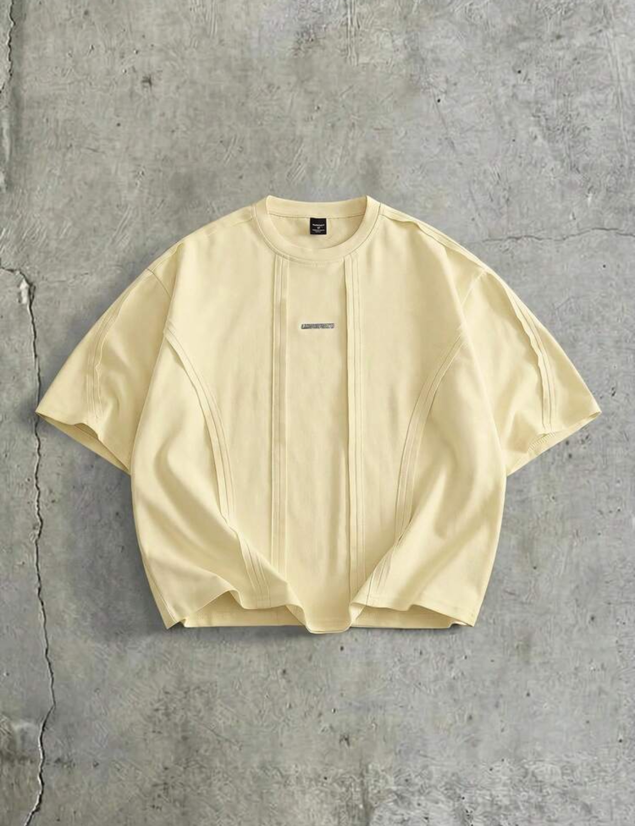 Contemporary Oversized Boxy Drop-Shoulder Espresso Dark Brown Heavyweight Cotton Streetwear T-Shirt Featuring Utilitarian Vertical Pintuck Seam Paneling and Minimalist Silver Metal Bar Chest Branding