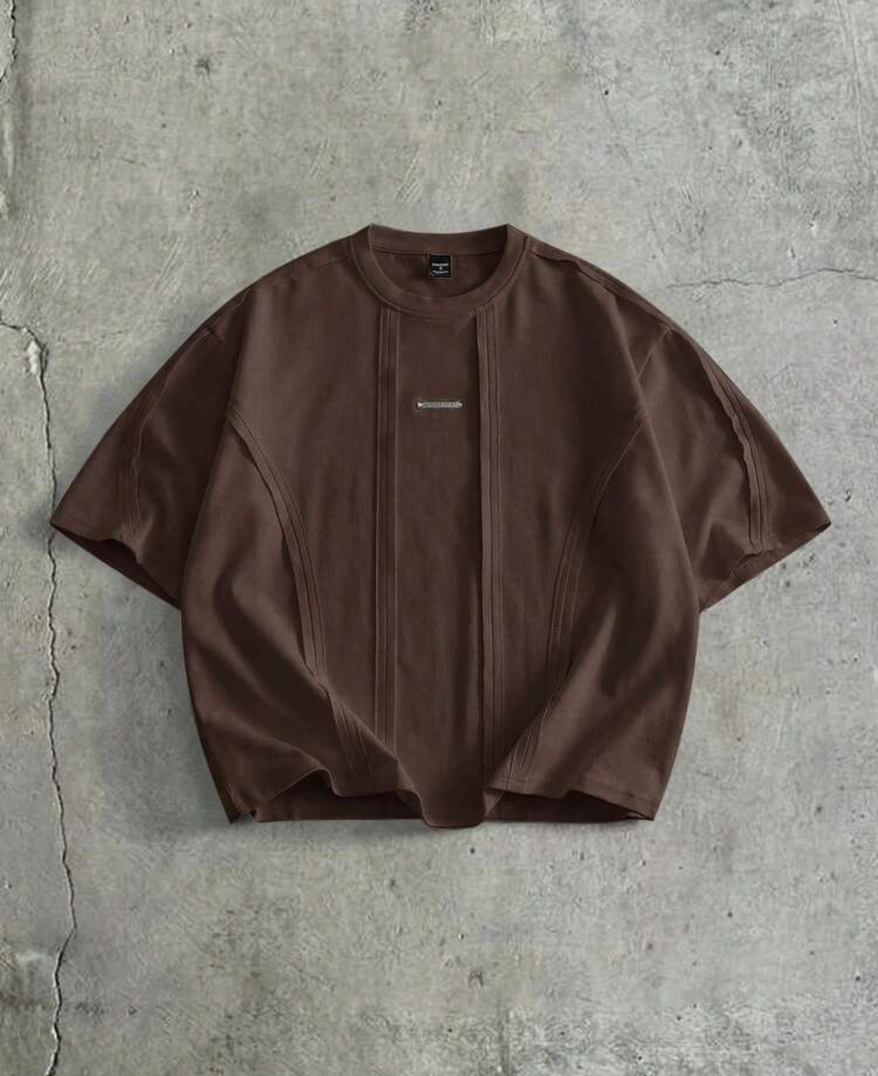 Contemporary Oversized Boxy Drop-Shoulder Espresso Dark Brown Heavyweight Cotton Streetwear T-Shirt Featuring Utilitarian Vertical Pintuck Seam Paneling and Minimalist Silver Metal Bar Chest Branding 3