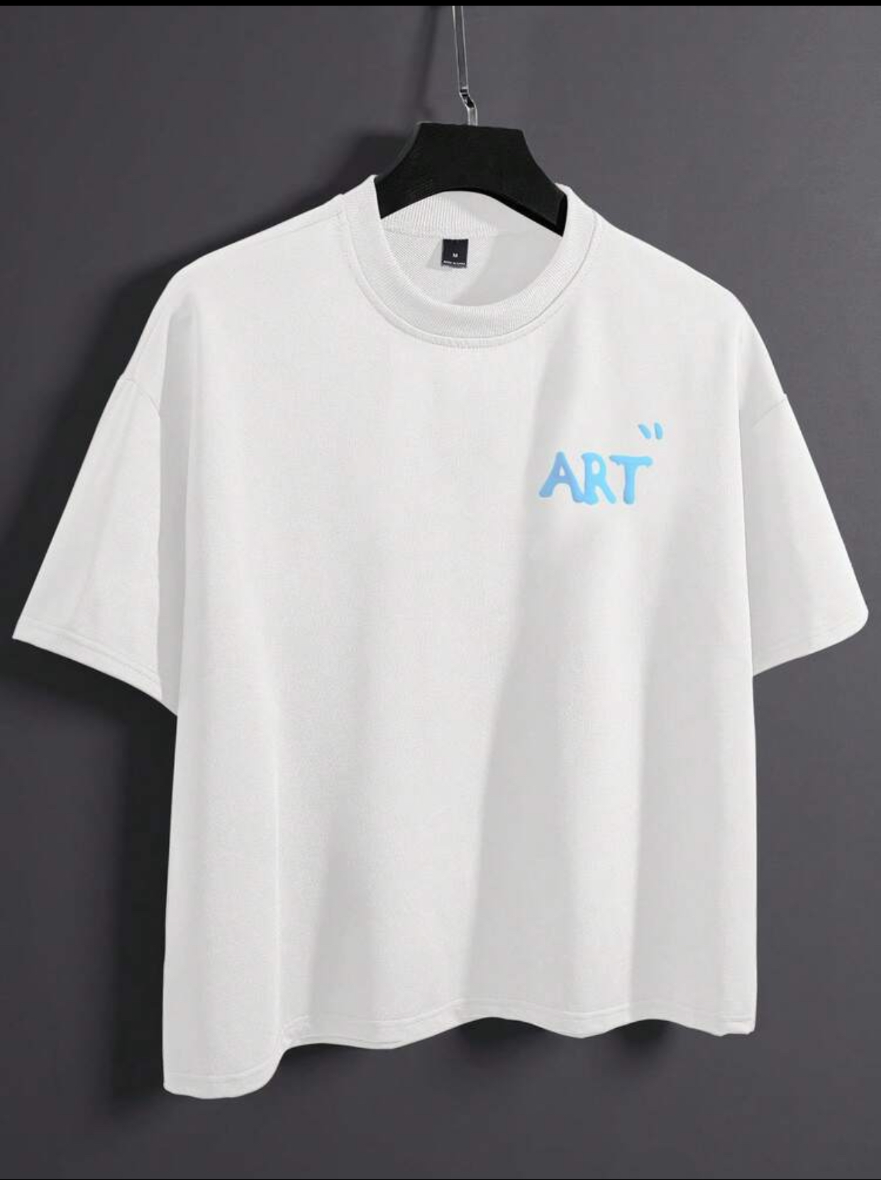 Minimalist Soft-Aesthetic Off-White Boxy Drop-Shoulder T-Shirt Embellished with a Light Sky Blue "ART" Puffy Bubble Text Graphic on the Left Breast