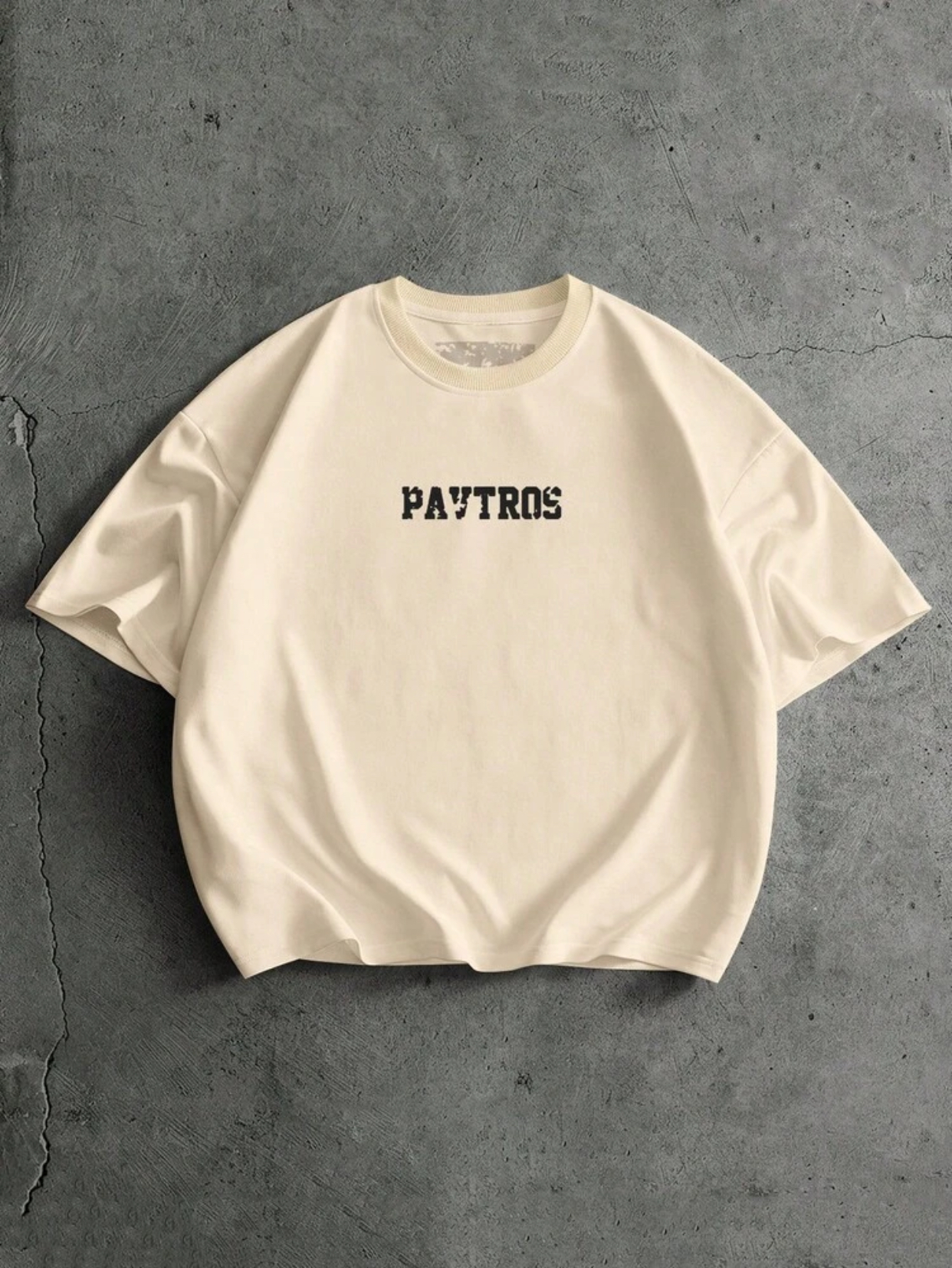 Minimalist Heavyweight Cream Boxy Oversized Drop-Shoulder T-Shirt Featuring a Centered Distressed Black Stencil-Style "PAVTROS" Typography Graphic