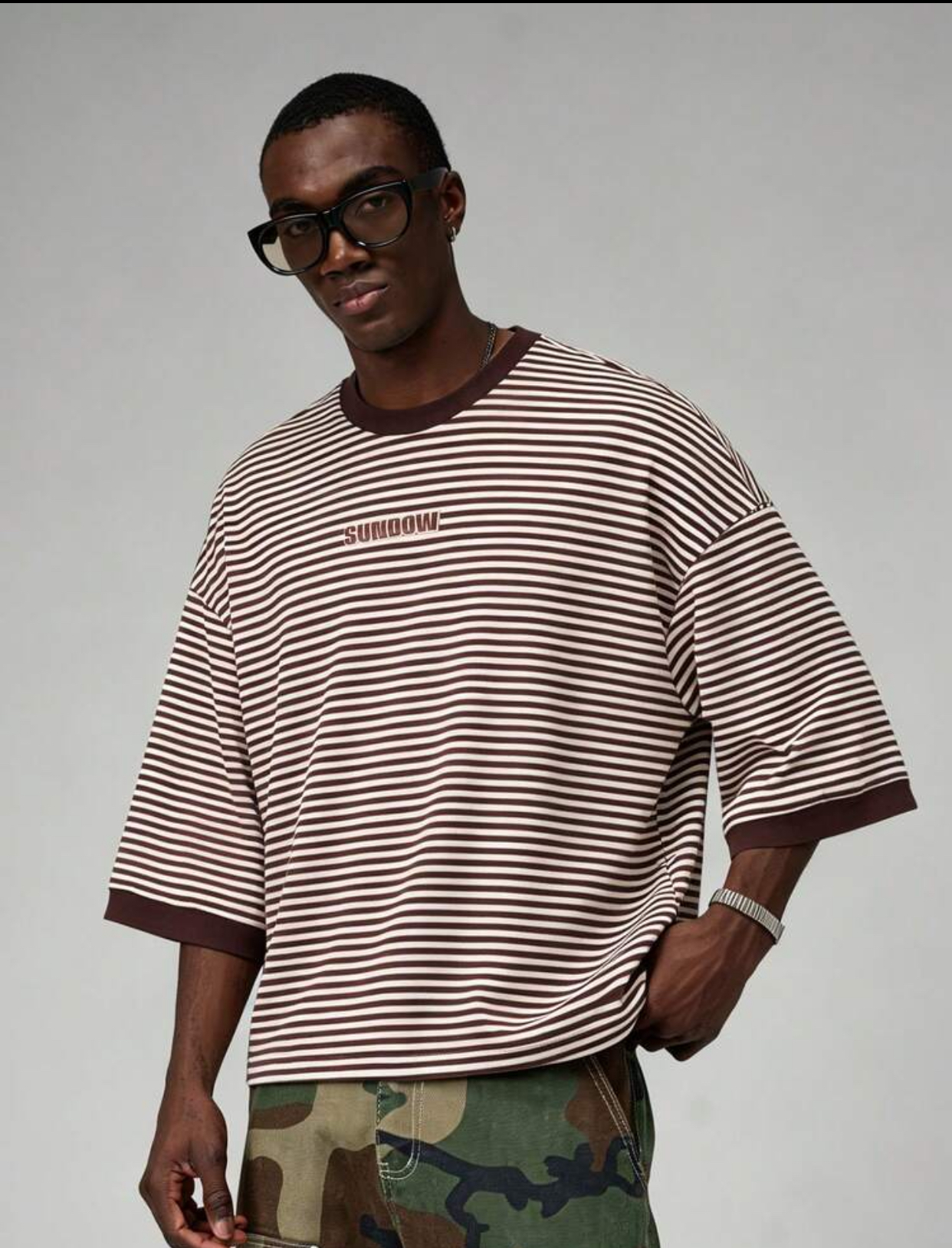Retro 90s Skate-Inspired Oversized Horizontal Striped T-Shirt in Chocolate Brown and Cream Featuring Solid Contrast Ribbed Elbow-Length Cuffs and Minimalist Torso Branding