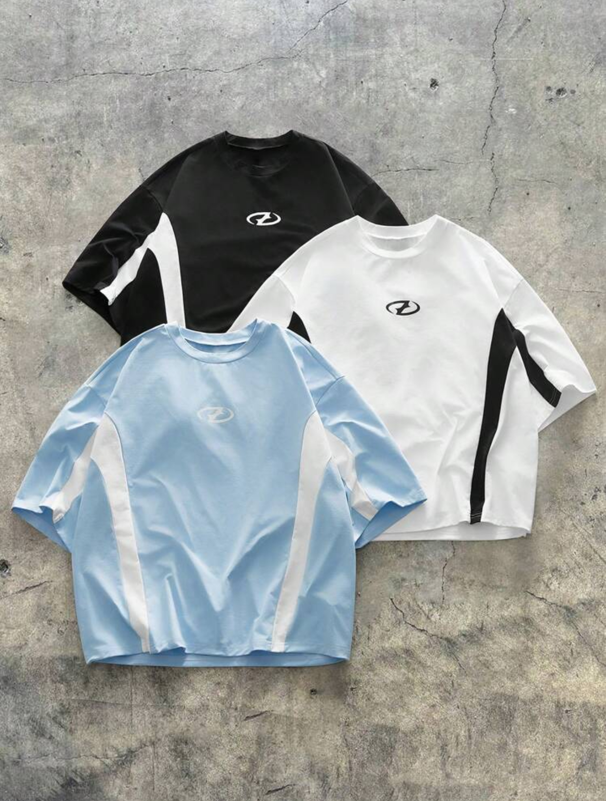 Y2K Cyber-Sportswear Heavyweight Panelled T-Shirt Capsule Collection in Navy Blue, Charcoal Grey, and Jet Black Featuring Aggressive Angular Side Strips and a Centered Minimalist Oval Cyber Emblem 3