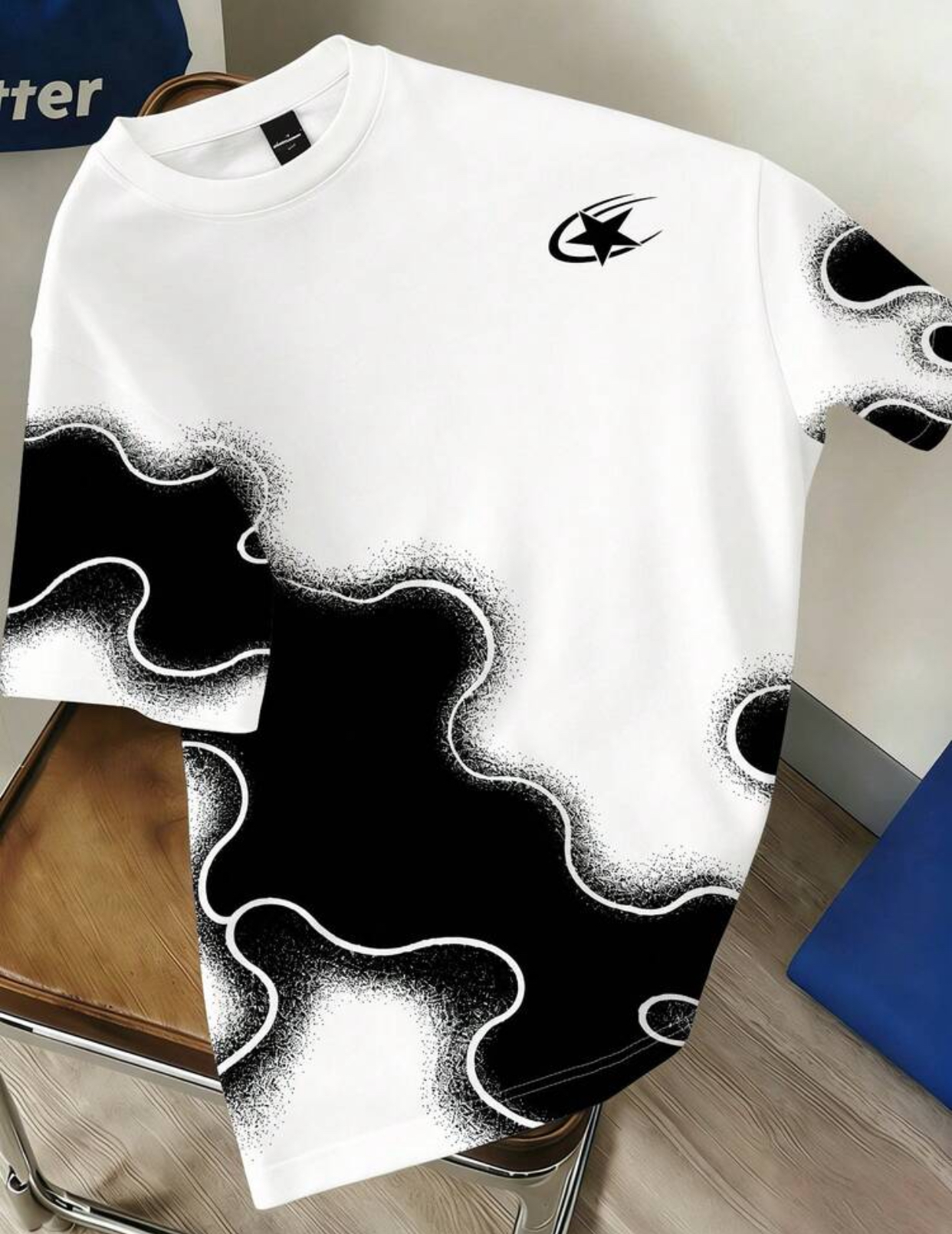 Modernist White Streetwear T-Shirt Embellished with an Earthy Chocolate Brown Liquid Amoeba Organic Pattern Featuring Distressed Airbrushed Stipple Edges and a Miniature Metallic Gold Comet Star Logo 3