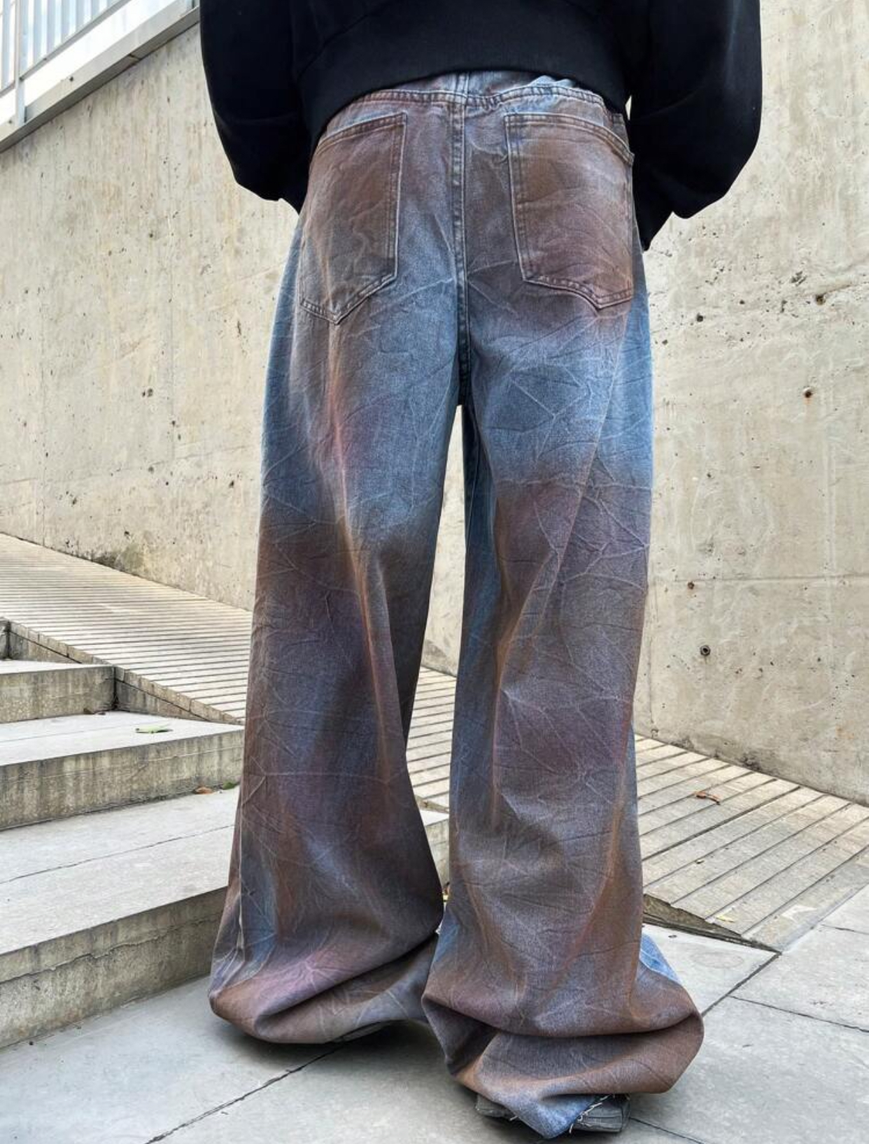 Avant-Garde Post-Apocalyptic Mud-Washed Ultra-Baggy Denim Jeans Featuring Heavy Rust-Toned Over-Dye Crinkle Textures and a Shredded Left-Thigh Distressed Slash 2