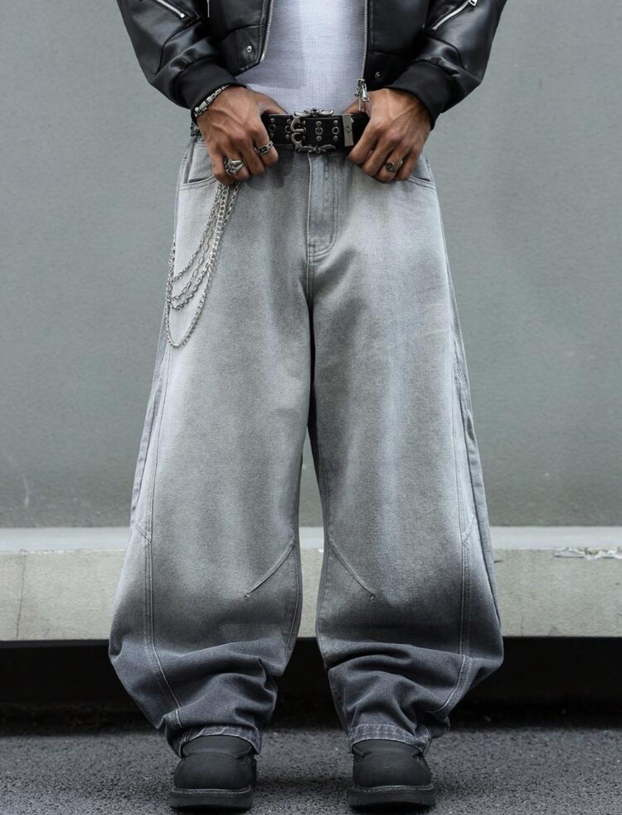 Avant-Garde Architectural Mineral Grey Wide-Leg Balloon Jeans Featuring Curved Ergonomic Structural Seams and a Triple-Link Silver Wallet Chain